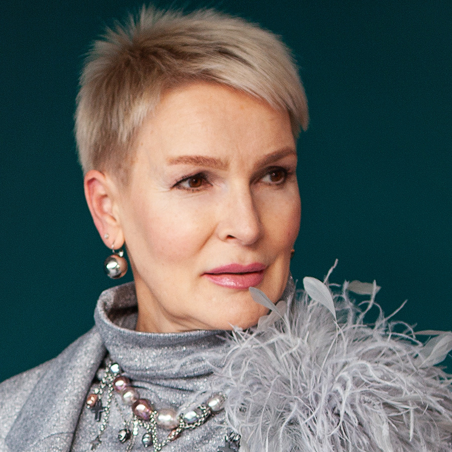 mature woman in a gray turtleneck