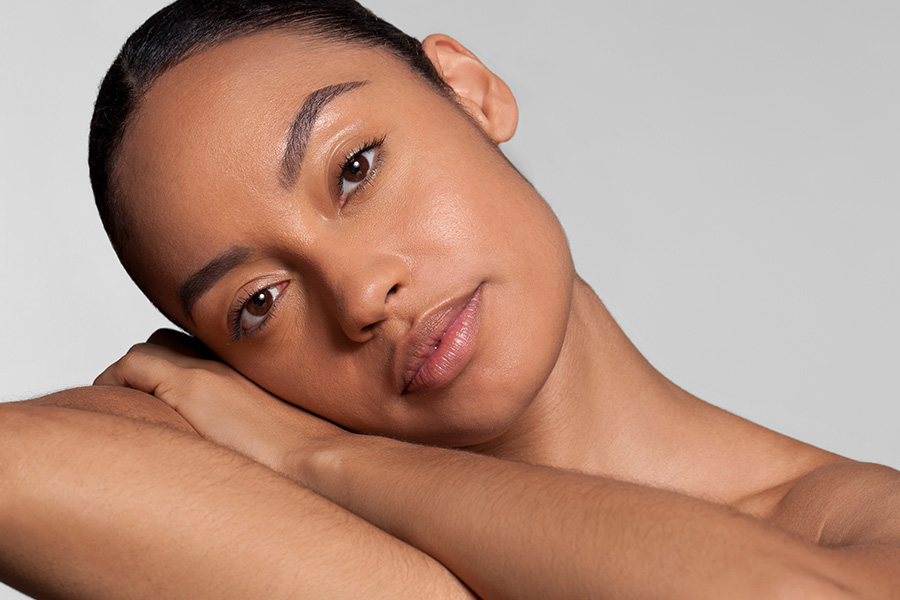young woman resting her head in her arms
