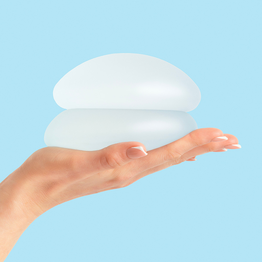 A person holding two types of implants