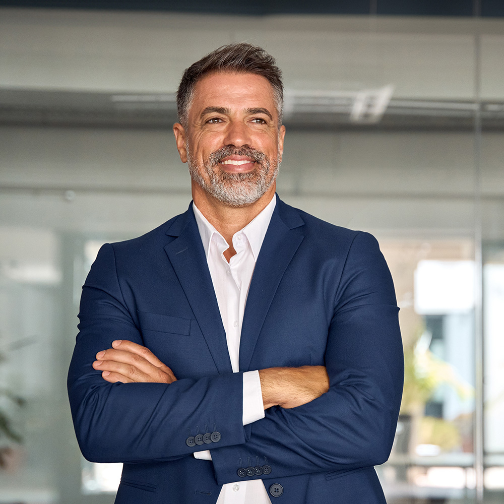 Man in a blue suit with his arms crossed